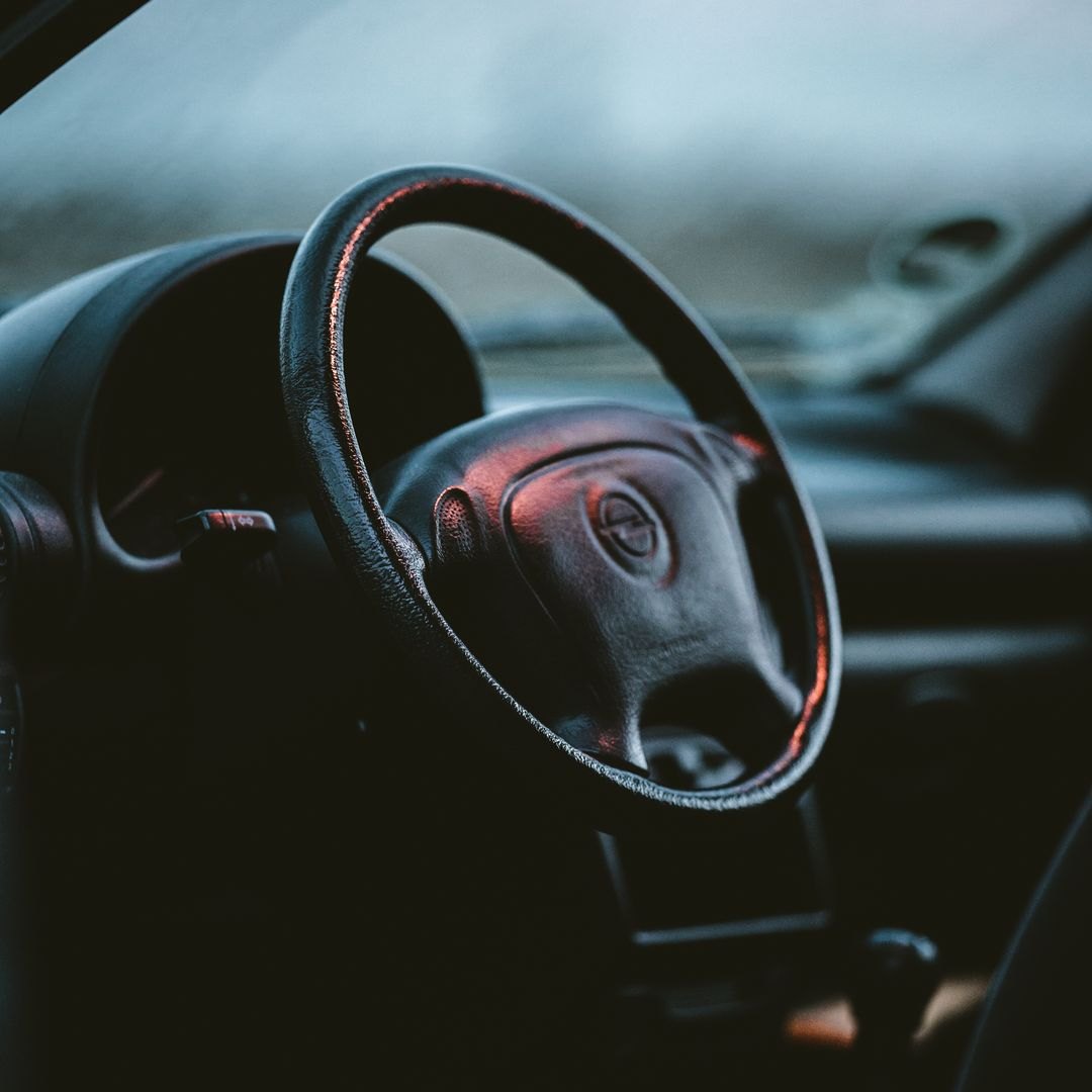 obd port security, the dashboard and steering column area of a car interior